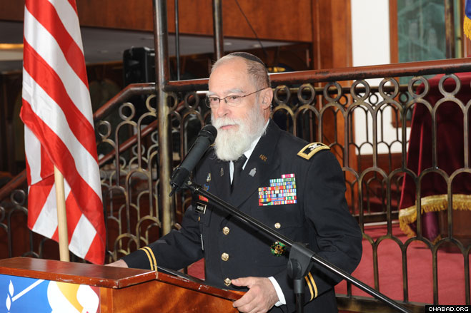 Col. Jacob Goldstein, a Chabad-Lubavitch rabbi who has served as a U.S. Army chaplain for more than three decades under a one-time exception to military grooming policy, speaks at the installation ceremony of Rabbi Menachem Stern.