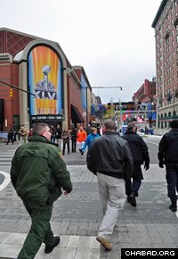 U.S. Customs and Border Protection officers and agents tour the vicinity around the site of Super Bowl XLVI. (Photo: CBP/Brian Bell)