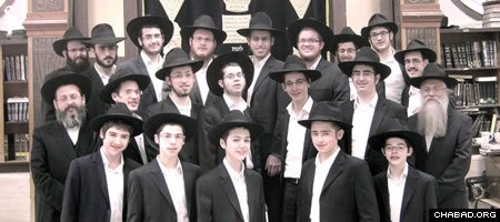 Descendants of Rabbi Chaim Ben-Zion Raskin pose for a picture at their Tomchei Temimim yeshiva in Kiryat Gat, Israel.
