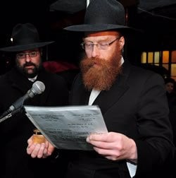  Rabbi Yeshaya Schtroks officiating at a wedding.