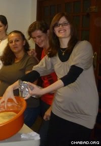 Dvorah Lea Raichman teaches Jewish women how to bake challah bread.