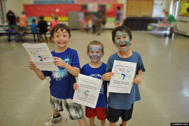 Camp Gan Israel of Orange County campers Arlo Stier, 8, and Noach Reich, 6, of Monroe have a blast studying the Hebrew alphabet with fellow camper Ethan Justin, 6, of Circleville.