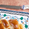 Why lightly run the knife over challah?