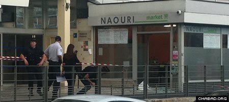 Police investigate the bombing of the Naouri kosher market in Sarcelles, France. (Photo: Menahem Ladaev/Anachinfos)