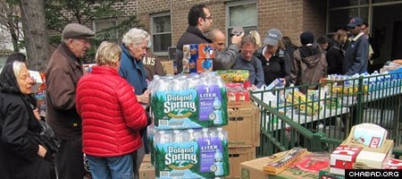 Volunteers prepare a distribution of food and water coordinated by Chabad-Lubavitch of Tribeca and SoHo two days after Hurricane Sandy struck New York City.