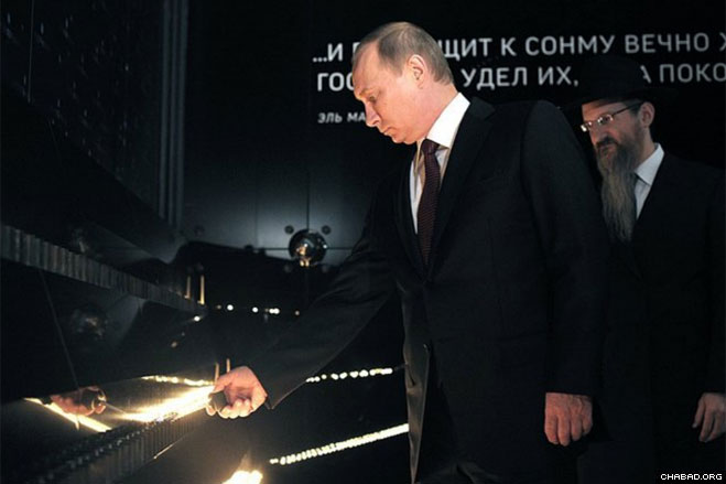 Tens of thousands of visitors have already come to the museum, which tells the story of the history of the Jews, Jewish traditions and life in Russia today. Here, Putin tries his hand at an interactive exhibit.
