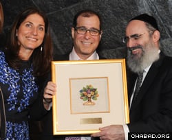 Marc and Esther Sholes received community service awards. Sholes recalled how his children went to Chabad’s camp and preschool, with one of them volunteering with the Friendship Circle, a special-needs buddy program.