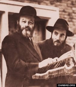 Rabbi Goldstein with the Lubavitcher Rebbe at a Lag BaOmer day parade in the 1950s.