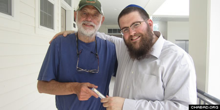Rabbi Chaim Bruk, right, and Mike Chaet of Bozeman with his new mezuzah