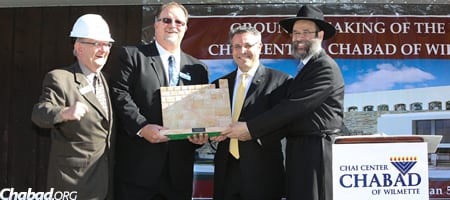 At the groundbreaking for the new building last fall are, from left, Marshall Kayman, Robert Sheck and James Herzog of Weinstein Funeral Home, with Chabad of Wilmette Rabbi Dovid Flinkenstein