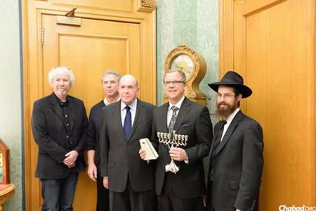 Saskatchewan Premier Brad Wall, center, with leaders of the Jewish community after receiving a menorah from Rabbi Simmonds.