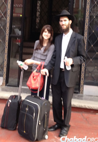 Rabbi Yoel and Rivky Wolf on the way to their new home in Chicago.