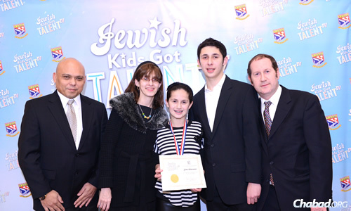 Dante Cabactulan, left, son of Libran N. Cabactulan, ambassador to the United Nations from the Philippines, came to see the "Jewish Kids Got Talent" competition, and met Estee and her parents, Chanie and Glenn Ackerman, and her older brother and table-tennis mentor, Akiva.
