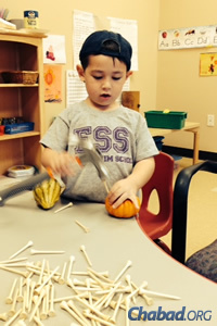 For preschool students at Gan Menachem in Dallas, doing is a major component of learning.