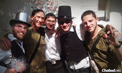 Mordy Botnick, left, and friends from Chayal el Chayal will again bring Purim cheer from around the world to lone soldiers in the IDF.