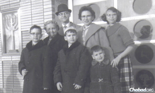 The Fisher family, including the rabbi's mother, Taibel, in front of Talmud Torah Ohev Shalom in the Canarsie neighborhood of Brooklyn