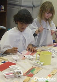Young artists at work. The new facility will offer much more space for activities like this, as well as for the Hebrew school.
