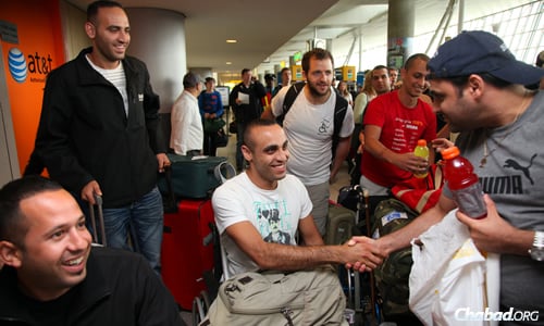 Chabad&#39;s Belev Echad (&quot;One Heart&quot;) brings wounded Israeli Defense Force soldiers and victims of terror to the United States for 10 days of touring, activities, socialization and inspiration, like this wheelchair-bound soldier from a previous trip. (Photo: Bentzi Sasson)