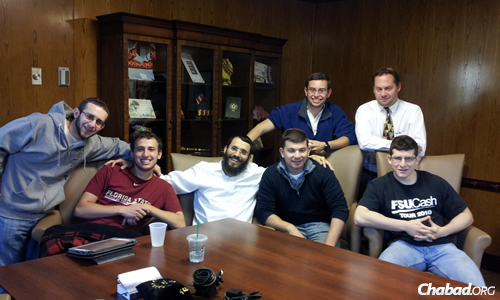 Students take time out for a little &quot;BLT&quot;—bagels, lox and tefillin with the rabbi.