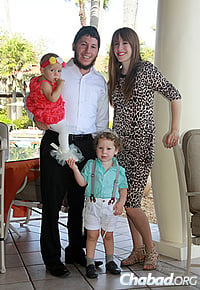 The Blasbergs with their children, Menny, 3, and Leah, 1