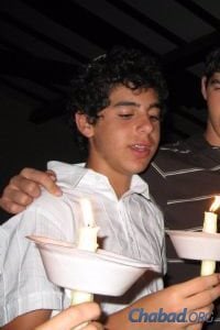 Sean Carmeli as a teen at a Havdalah service at Camp Gan Israel near his home in South Padre Island, Texas.