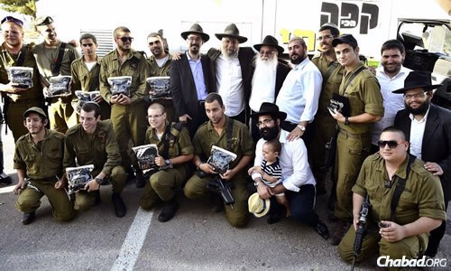 Ten soldiers from the Israeli Defense Forces recently received their own sets of tefillin. Rabbi Moshe Gourarie, co-director of Chabad of Toms River, N.J., was in Israel at the time and met the young men.
