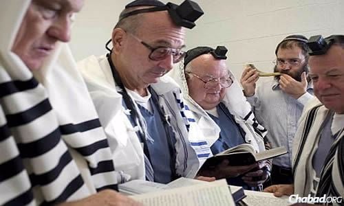 Chabad Rabbi Menachem Katz (second from right, blowing shofar), director of prison and military outreach for the Florida-based Aleph Institute, has been visiting prisons during the High Holidays for more than 20 years.