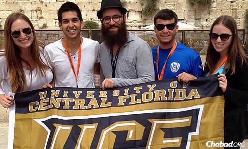 Tell, a senior, in Israel with fellow students from the University of Central Florida in Orlando and, in the center, Rabbi Chaim Lipskier, co-director of Chabad of UCF