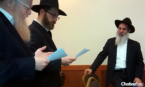 Marc Shudnow, 45, center, recently participated in his own &quot;pidyon haben&quot;—or “redemption of the [firstborn] son”—ceremony since it had not been done for him as a baby. With him are the Kohen, Dovid Grinker, left, who presided over the ceremony, and, far right, Rabbi Yosef Posner, director of Lubavitch Chabad of Skokie, Ill.