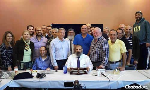A core group of 20 to 25 students have been coming daily to Chabad of the Valley in Encino, Calif., to study the Mishneh Torah with Rabbi Yehoshua B. Gordon. Regular attendee Daniel Aharonoff, seated at left, persuaded the rabbi to allow a camera into the room.