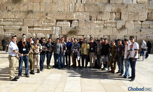 A group of students from the University of Central Florida at the Western Wall in Jerusalem, as part of a Taglit-Birthright Israel trip, accompanied by Chabad Rabbi Chaim Lipskier.