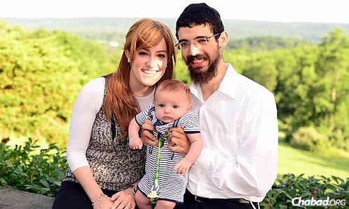 Rabbi Levi and Adina Tiechtel, with their son Mendel, co-directors of a new Chabad House at Purdue University in Indiana