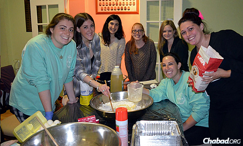 Women bake challah at Chabad Serving Drexel University in Philadelphia, co-directed by Rabbi Chaim and Moussia Goldstein.