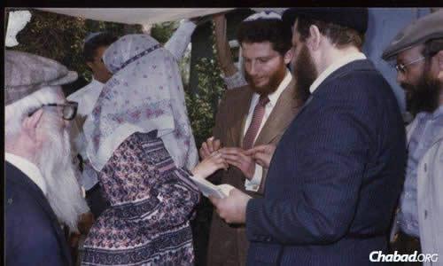 In 1984, the late Canadian Rabbi Jacob Immanuel Schochet, right, was sent on behalf of Chabad to the Soviet Union. Among his many clandestine tasks was to conduct a secret Jewish wedding for a young couple named Yuli (Edelstein) and Tanya.