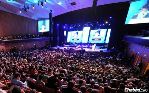 Tens of thousands of celebrants from all walks of Jewish life are expected to attend a massive Yud Tes Kislev "farbrengen" at Jerusalem’s International Convention Center, Binyanei HaUma. Last year, Rabbi Yoel Kahn was a featured speaker. (Photo: Meir Alfasi)