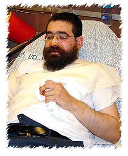 Rabbi Chaim Kaplan, Chabad-Lubavitch emissary in Safed, Israel, recovers from shrapnel wounds that landed a meter from his car