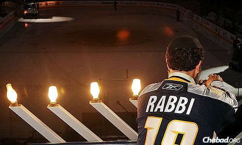 Rabbi Yitzchok Tiechtel, co-director of Chabad of Nashville in Tennessee, will light the menorah between periods on Tuesday, Dec. 16—the first night of Chanukah—in the arena of the Nashville Predators ice-hockey team.