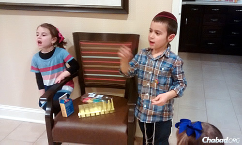 The kids came supplied with a box of chocolate coins, a tin menorah and some colorful Chanukah-shaped cookies.