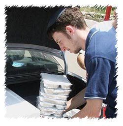 A student volunteering, for Chabad of Kiryat Shmona, to deliver more then 1,000 meals daily