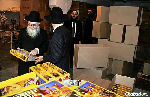 Rabbi Chaikin looks at the finished product: a colorful box of high-standard shmurah matzah, baked in Dnepropetrovsk, Ukraine, and ready to be shipped to anywhere in the world.