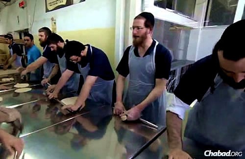 Rolling the dough for shmurah matzah at the historic bakery in Kfar Chabad, Israel.