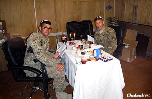 Almost like home: Two Jewish servicemen get ready for their seder. (Photo: The Aleph Institute)
