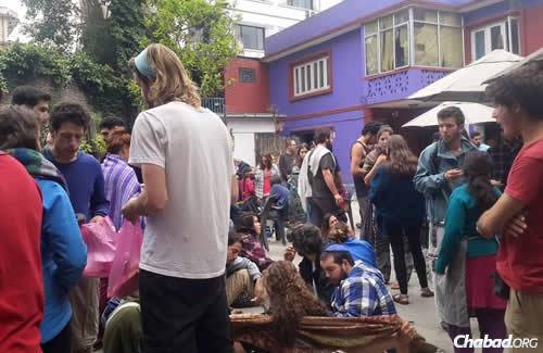 Backpackers and tourists at the center after the quake, which occurred around noon on Saturday. Afteshocks continued into the night.