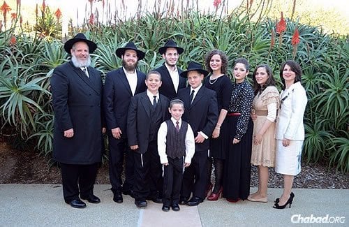 The Chabad center is co-directed by Rabbi Yeruchem and Nechama Eilfort, shown with their family.