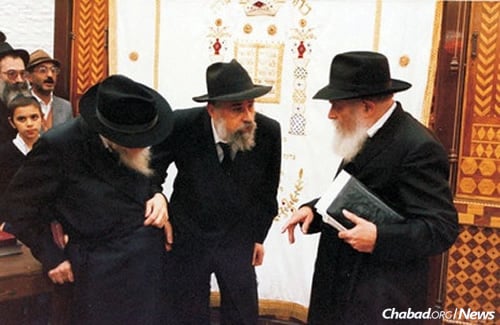 Rabbi Klein, center, joined the Rebbe&#39;s secretariat as an aide to Rabbi Chaim Mordechai Aizik Hodakov, left, the Rebbe&#39;s chief of staff.