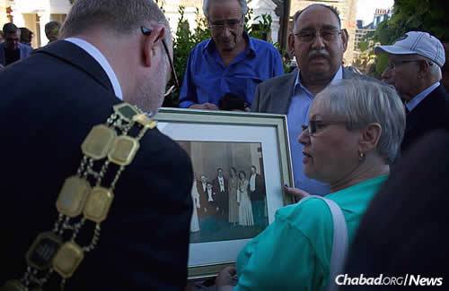 Congregants of the former synagogue show photos and tell stories of family history and involvement in the Islington Jewish community.