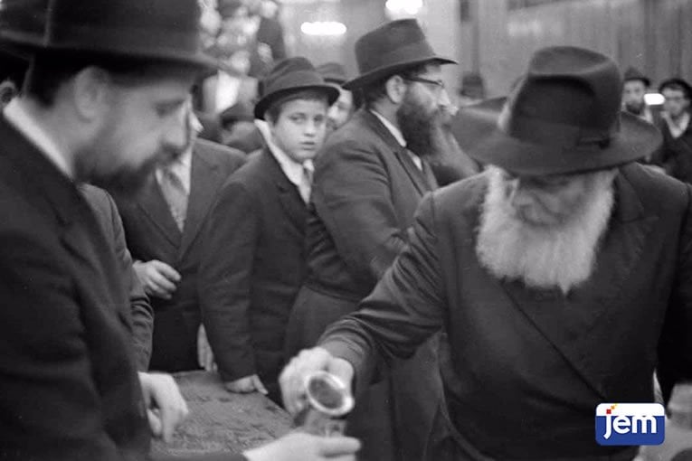 Receiving wine from the Rebbe&#39;s cup following Simchat Torah, 5737.