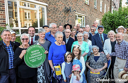 Some of the nearly 100 people who attended the June 4 ceremony unveiling the plaque.
