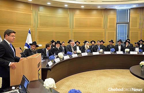 MK Ofir Akinus (Likud) addresses those assembled in the Knesset. (Photo: Meir Alfasi)