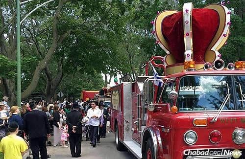 The parade was led by a special retrofitted firetruck, complete with a crown to mark the occasion.